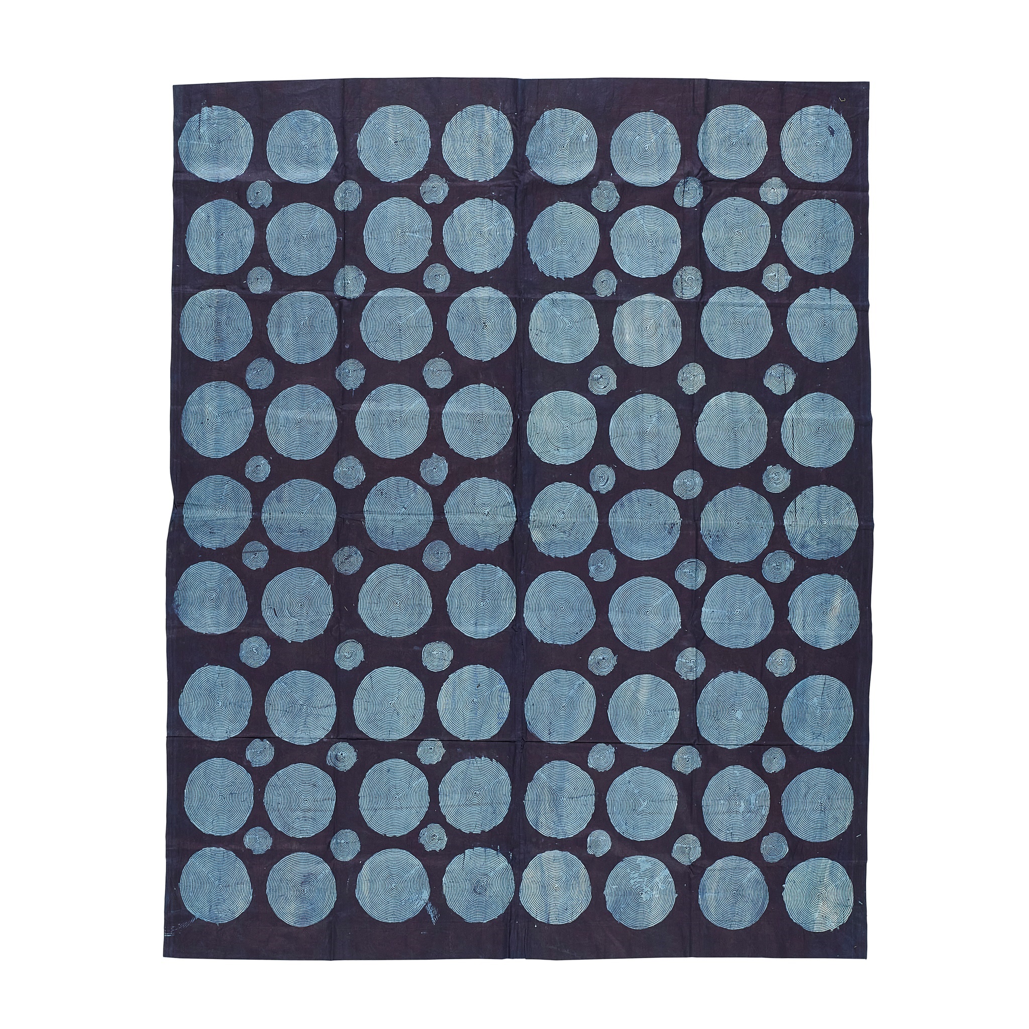 LOT 192 | YORUBA ADIRE TEXTILE | NIGERIA dyed cotton, with rows of light blue circles on a navy ground 204cm x 173cm | Sold for £2,750 + fees Provenance: The Keir McGuinness Collection of African Textiles
